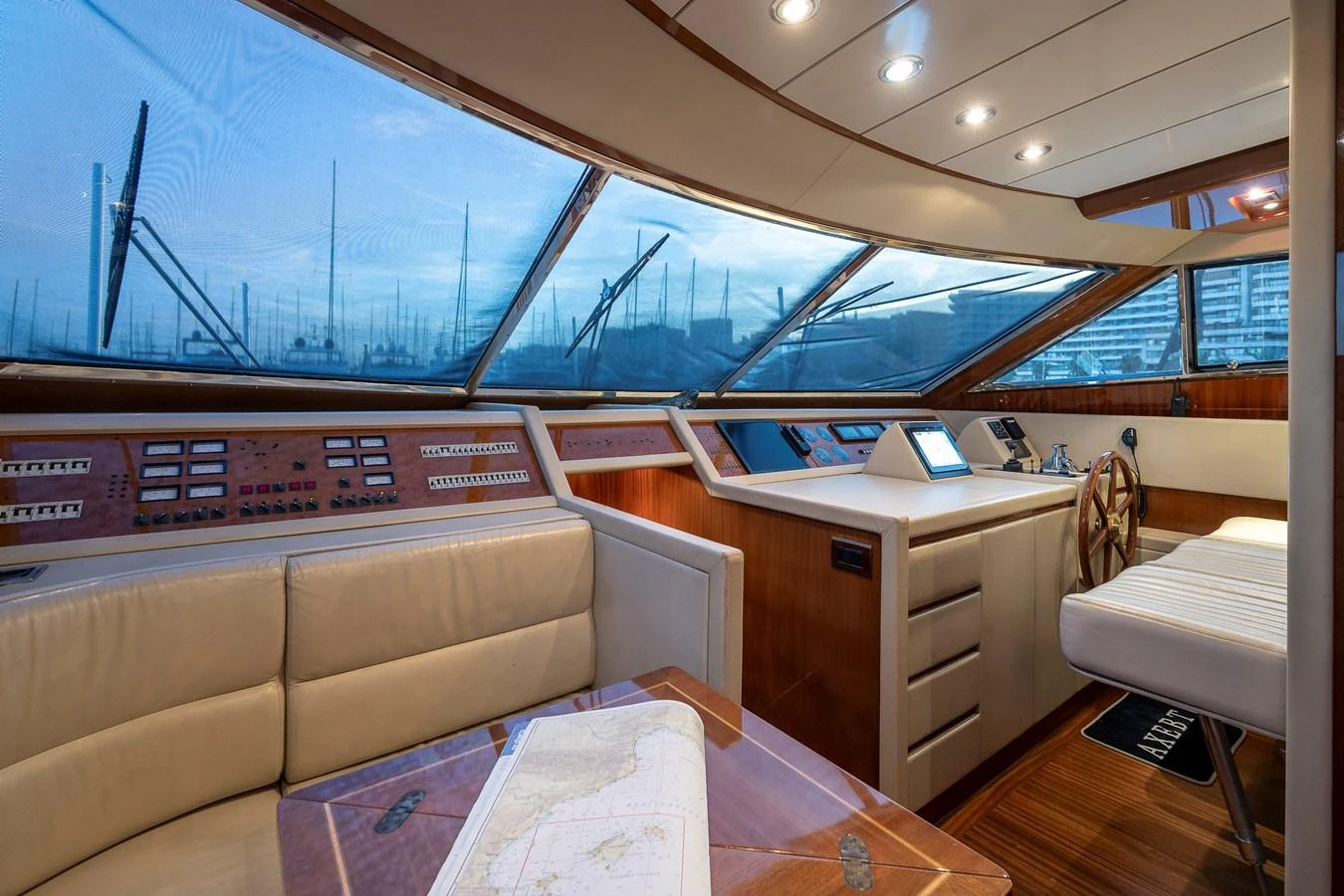 a room with a couch and a laptop on a table aboard AXEBT Yacht for Sale