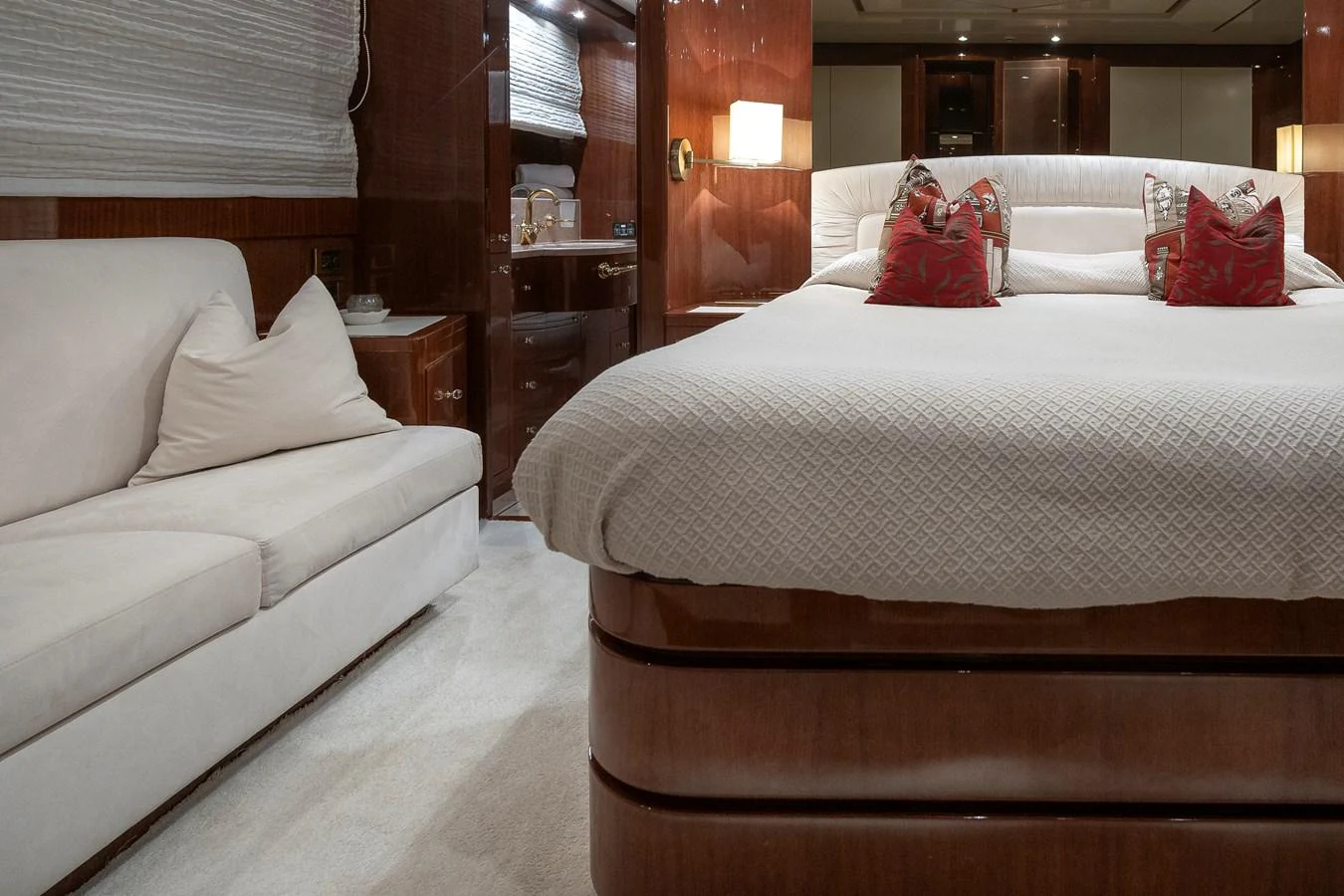 a bed with a white bed aboard AXEBT Yacht for Sale
