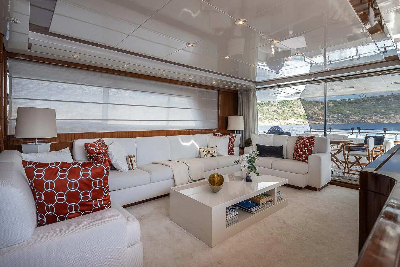 a living room with a large window aboard AXEBT Yacht for Sale