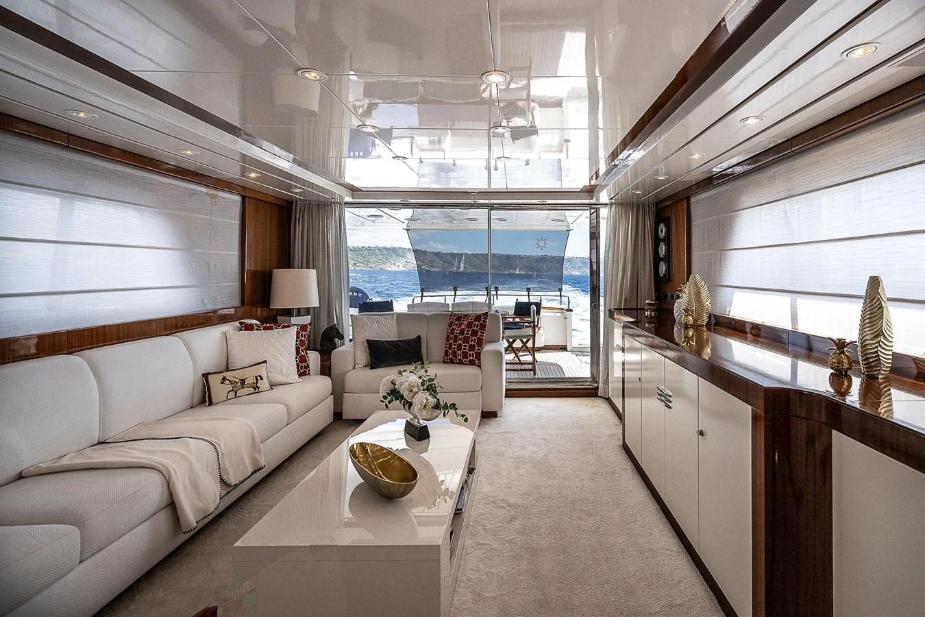 a living room with a large window aboard AXEBT Yacht for Sale