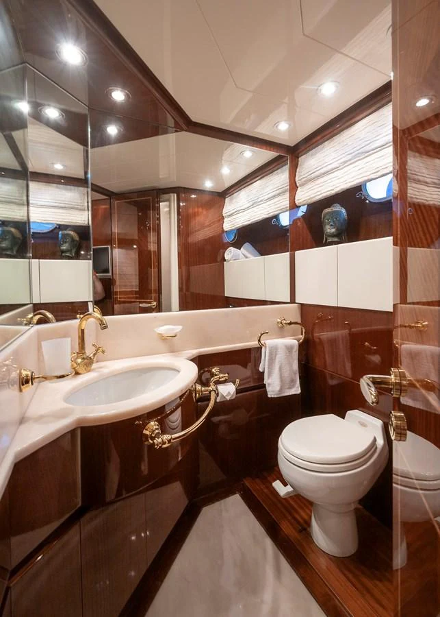 a bathroom with a sink toilet and a bathtub aboard AXEBT Yacht for Sale