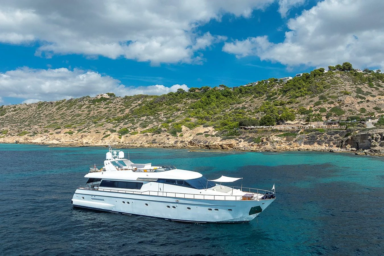 a white boat in the water aboard AXEBT Yacht for Sale
