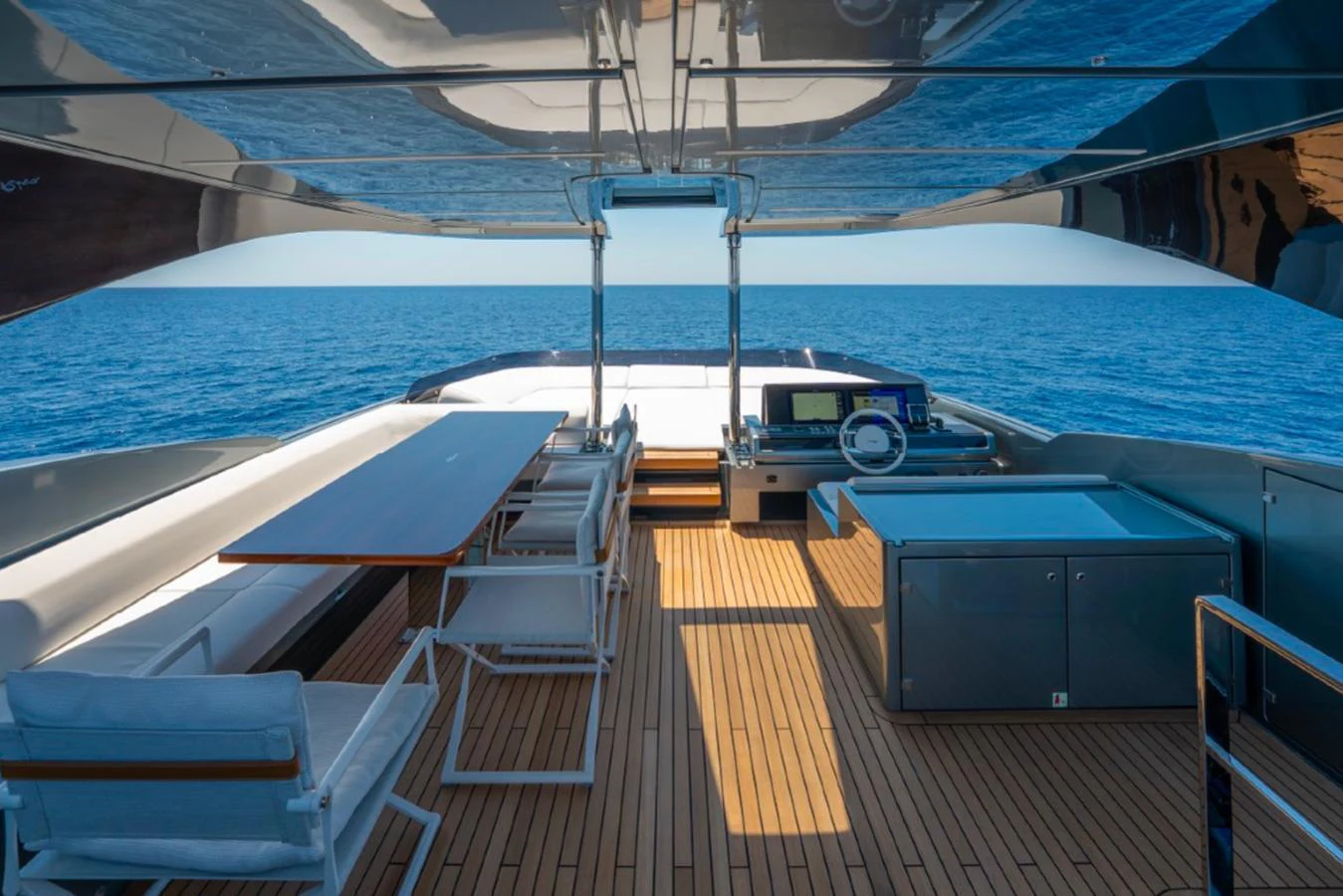 The flybridge offers a spacious and luxurious outdoor area with stunning ocean views. aboard COCO Y Yacht for Sale