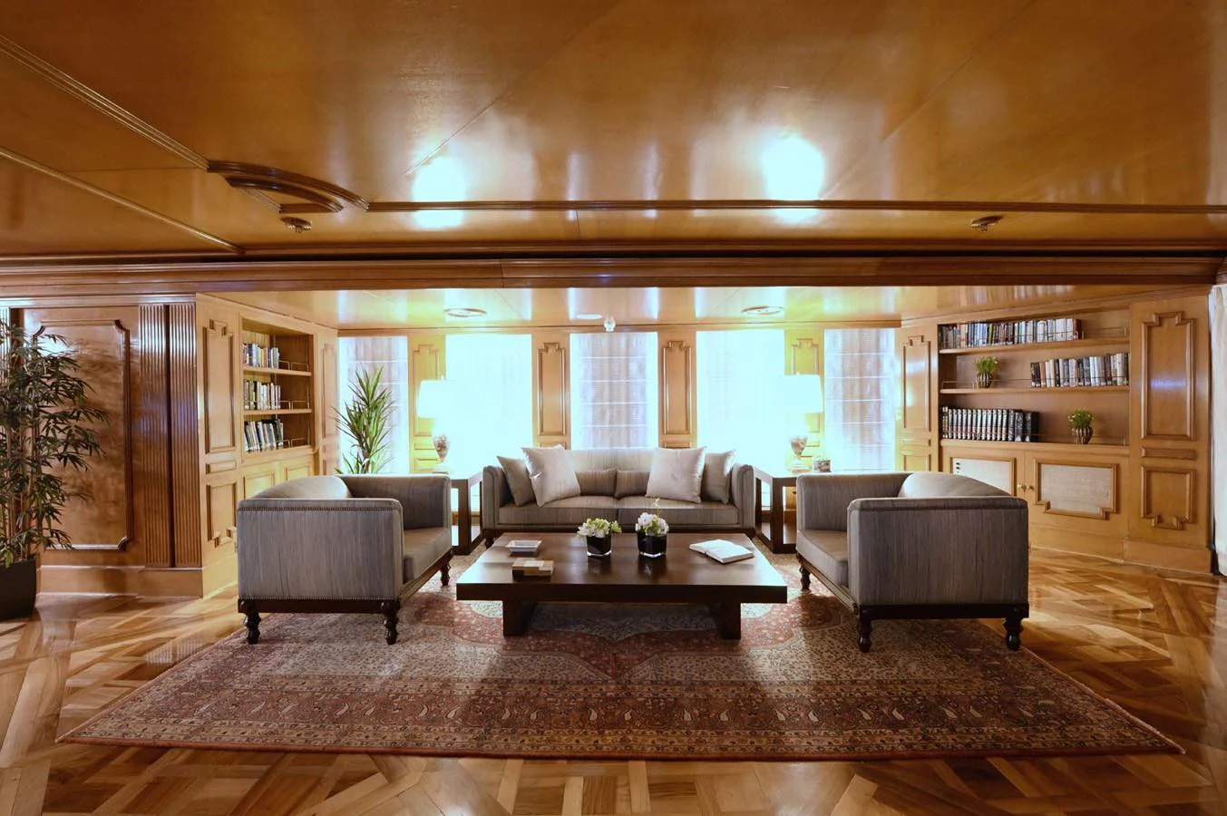The salon features elegant wood paneling, plush seating, and a sophisticated ambiance. aboard LADY SARYA Yacht for Sale