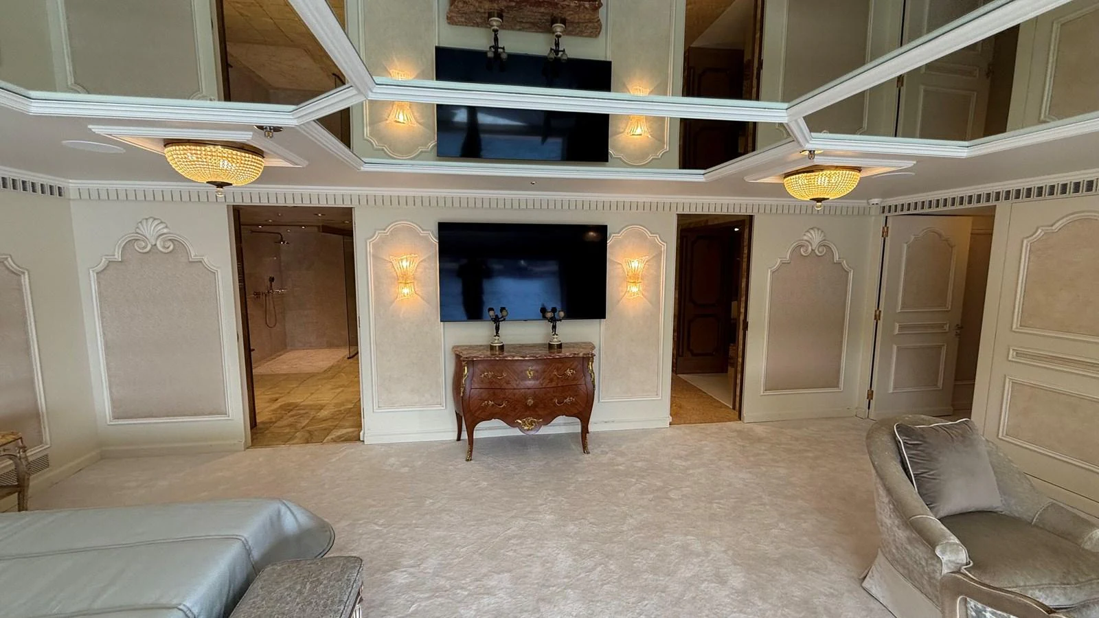 The yacht's interior features an elegant and spacious living area with luxurious furnishings and ambient lighting. aboard LADY SARYA Yacht for Sale