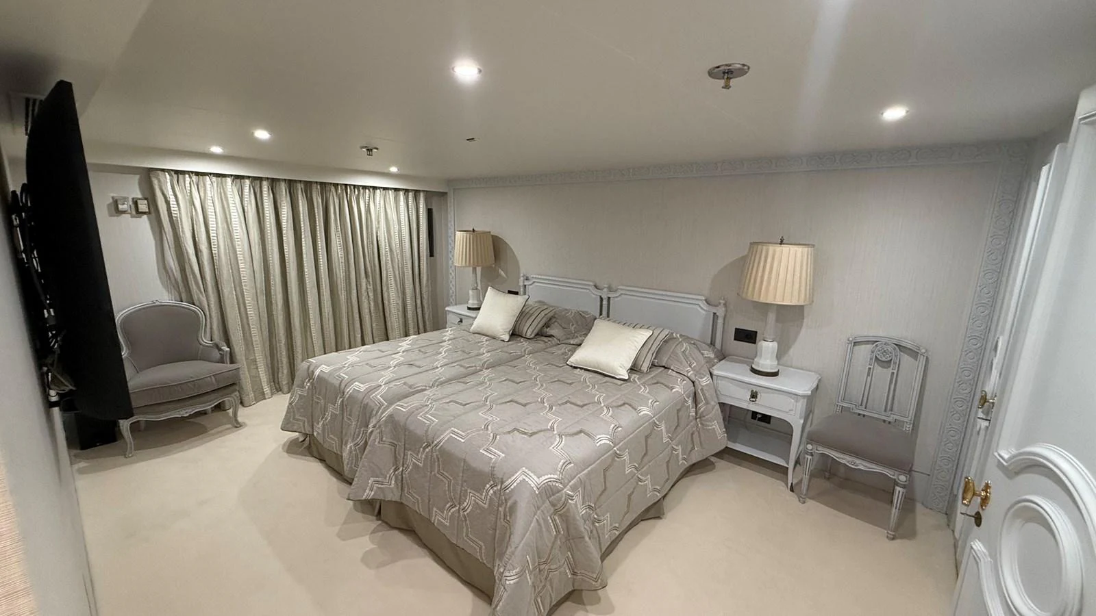 The stateroom features a spacious and elegant design with twin beds and luxurious decor. aboard LADY SARYA Yacht for Sale