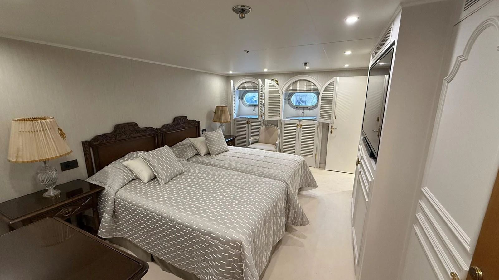 The guest stateroom offers a cozy and elegant retreat with twin beds and tasteful decor. aboard LADY SARYA Yacht for Sale