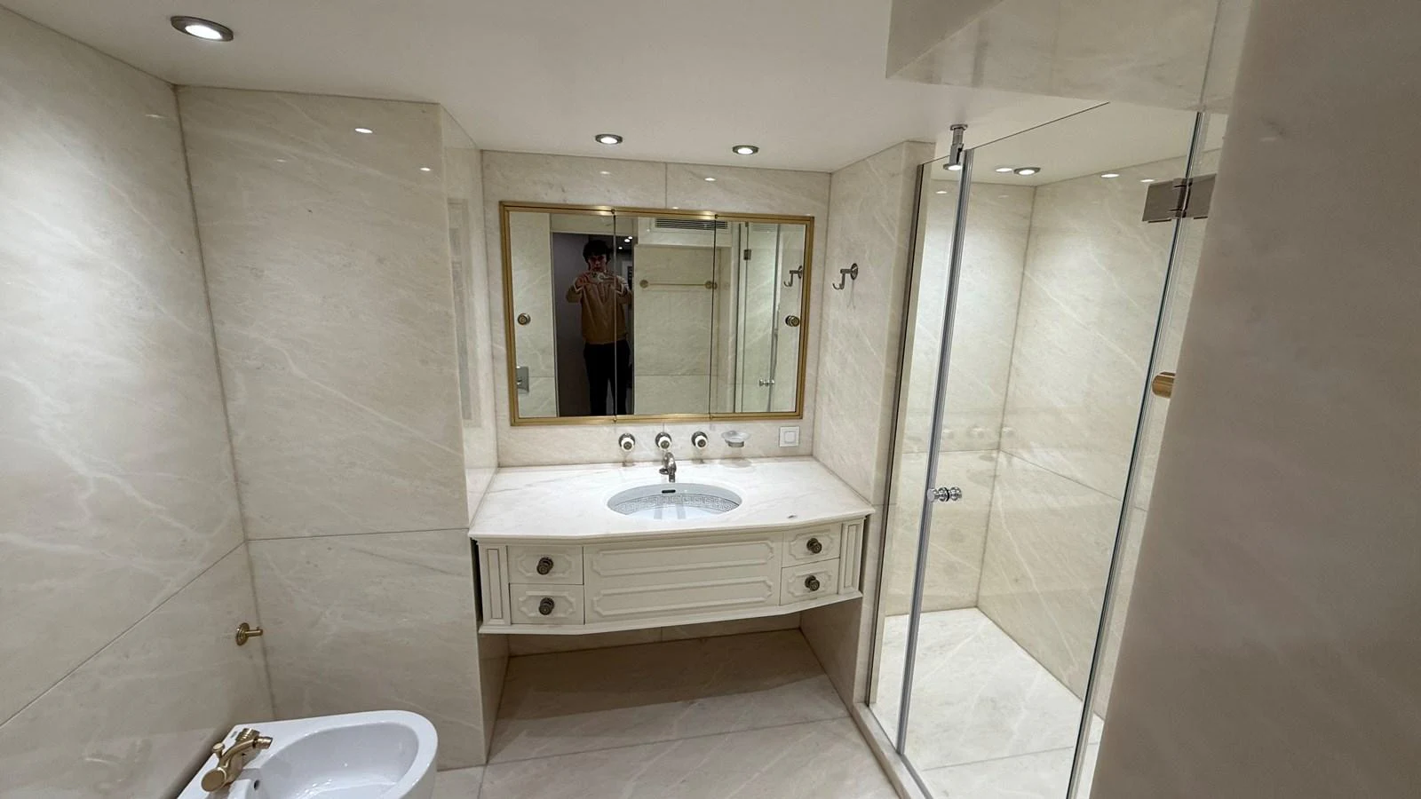 This elegant yacht bathroom features a spacious shower, a stylish vanity, and luxurious marble finishes. aboard LADY SARYA Yacht for Sale