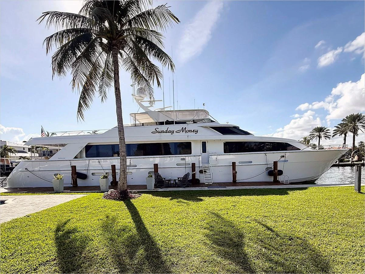a large white yacht aboard 100' HATTERAS 2001 CUSTOM YACHT Yacht for Sale