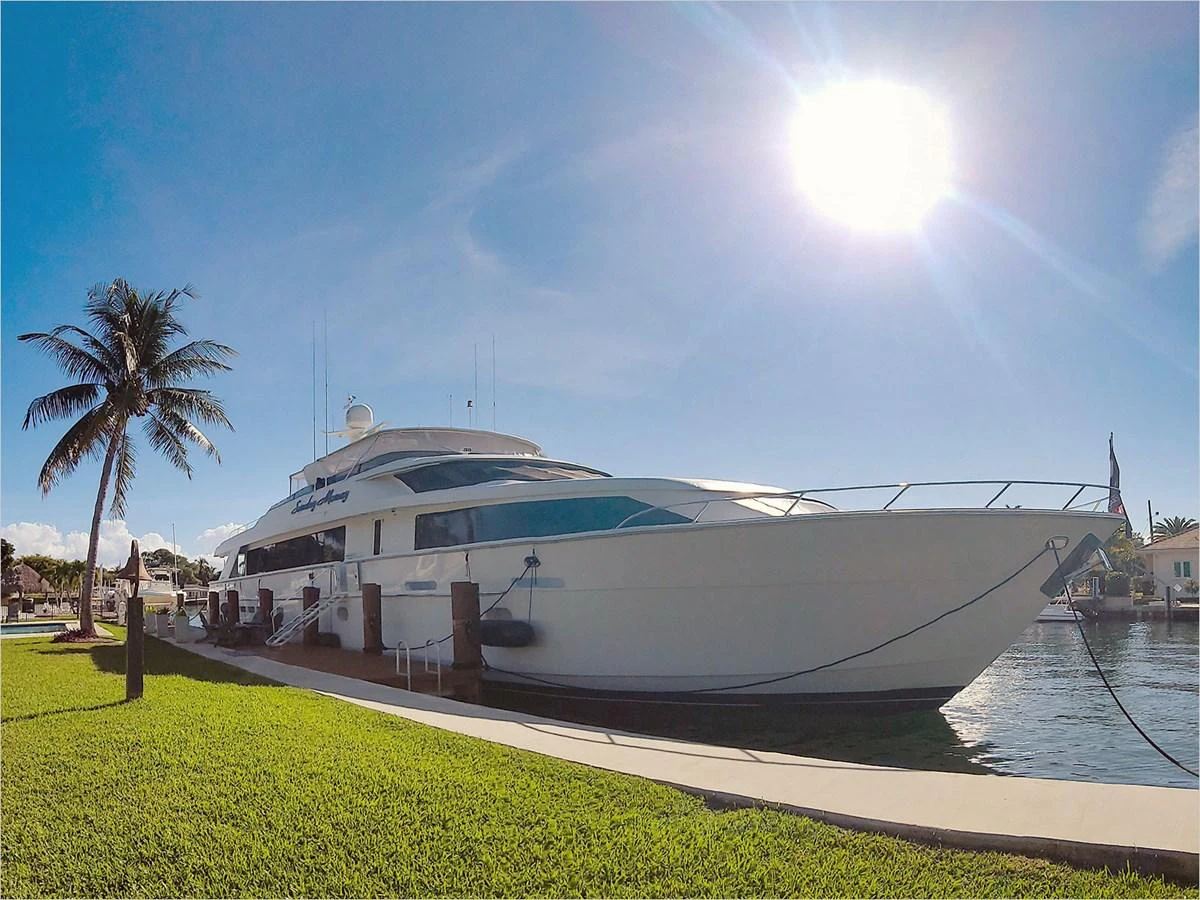 a large white yacht docked aboard 100' HATTERAS 2001 CUSTOM YACHT Yacht for Sale