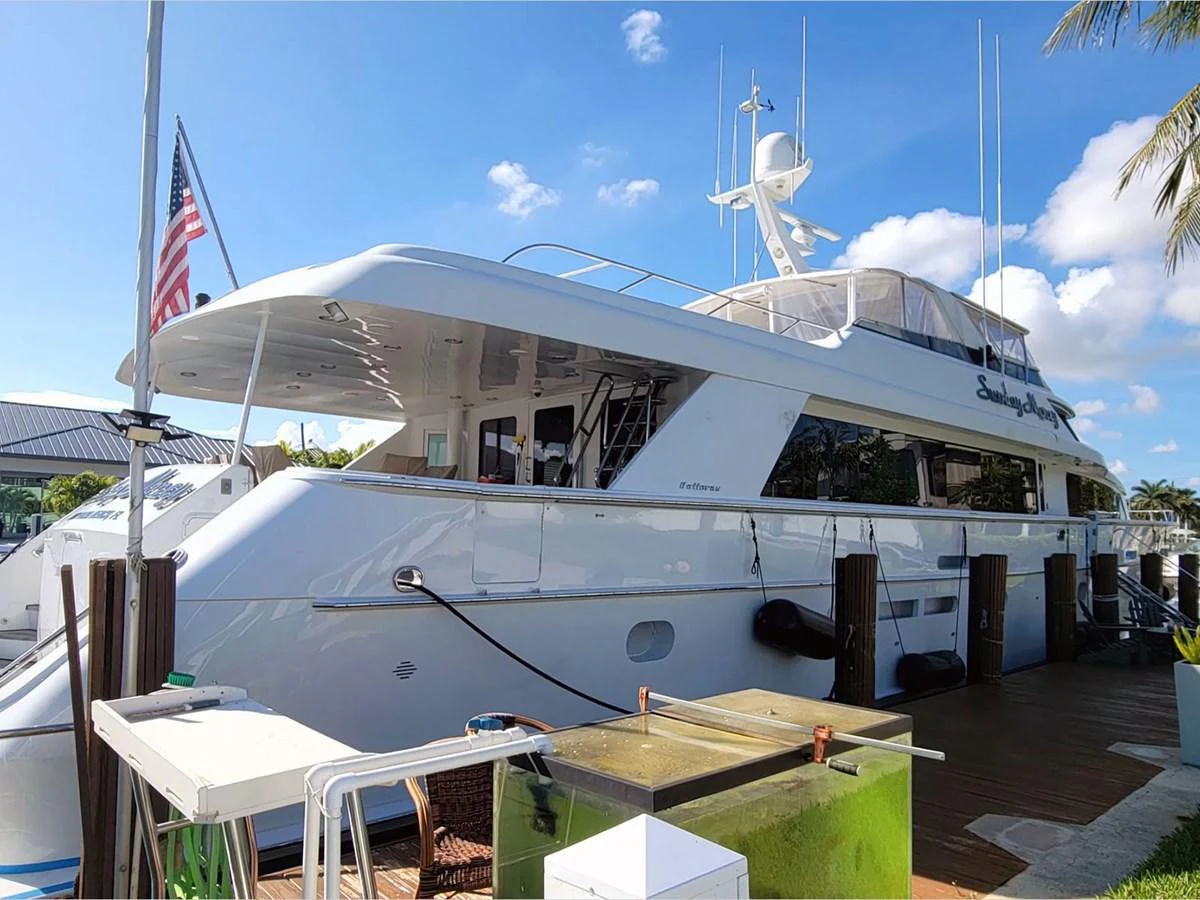 a large white boat aboard 100' HATTERAS 2001 CUSTOM YACHT Yacht for Sale