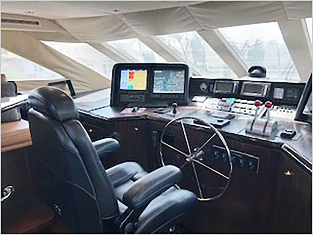 inside of a vehicle with many monitors and controls aboard 100' HATTERAS 2001 CUSTOM YACHT Yacht for Sale