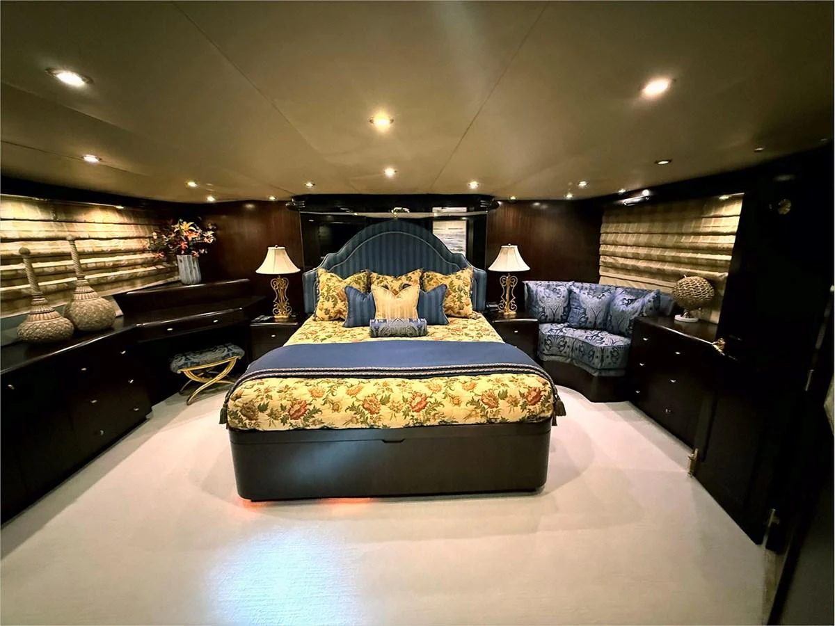 a large bedroom with a large bed aboard 100' HATTERAS 2001 CUSTOM YACHT Yacht for Sale