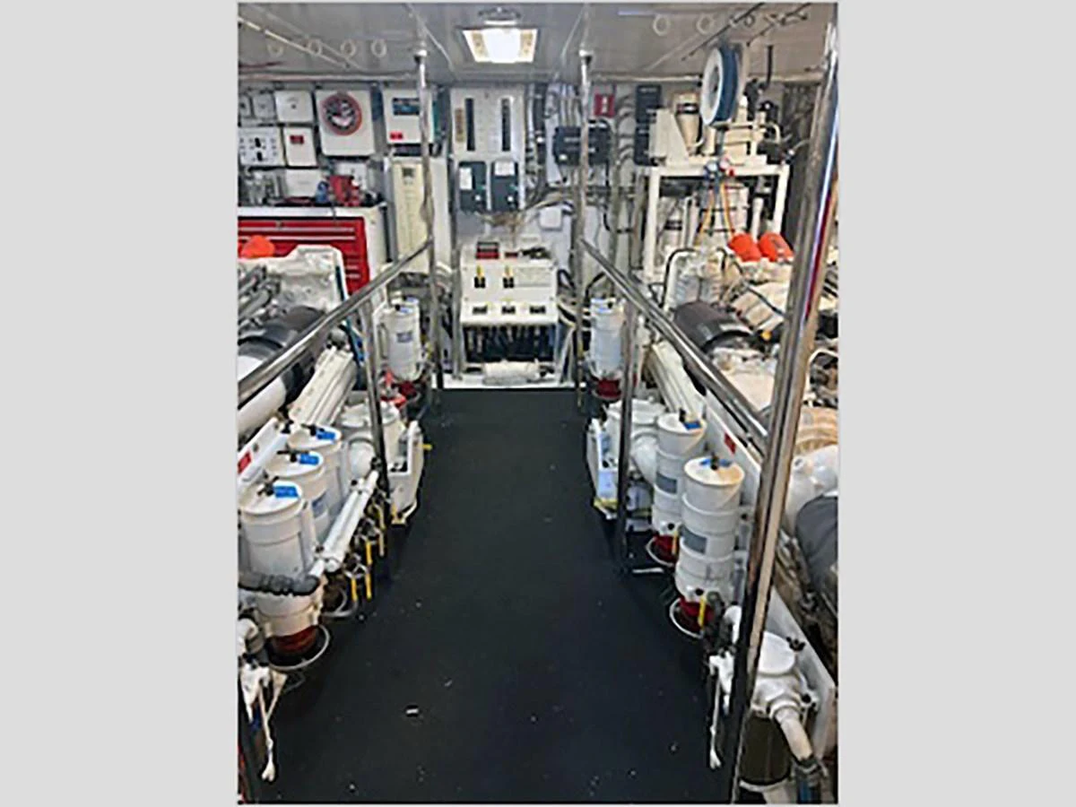 a room with shelves and equipment aboard 100' HATTERAS 2001 CUSTOM YACHT Yacht for Sale