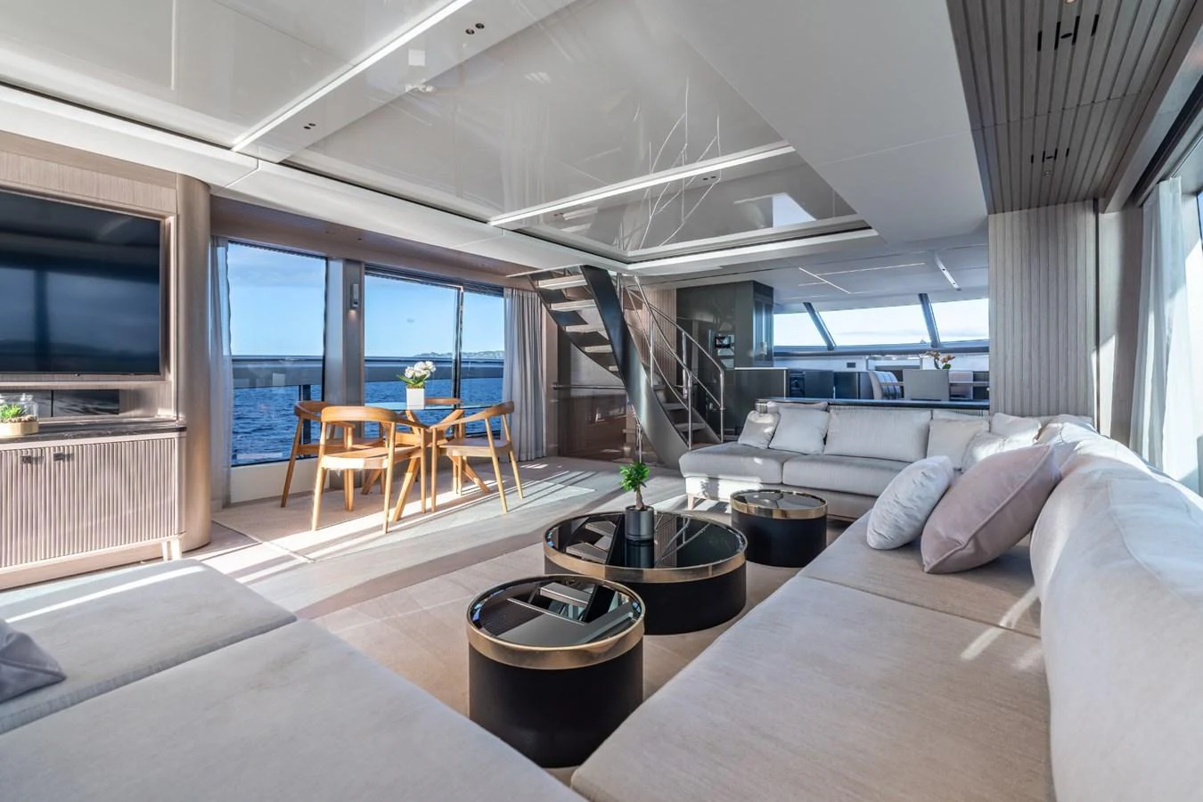 a living room with a large window aboard AURELIUS Yacht for Sale