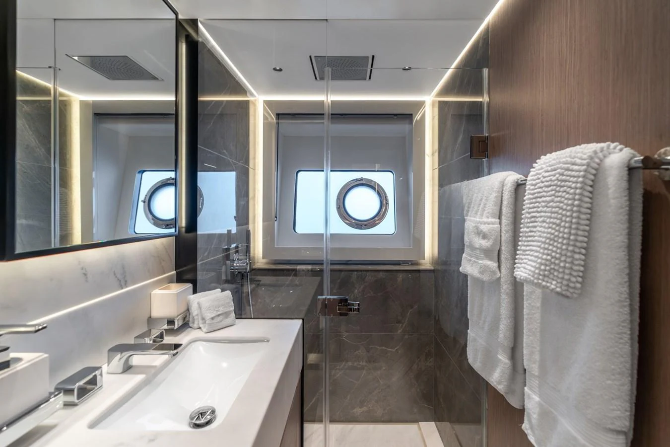 a bathroom with a sink and a mirror aboard AURELIUS Yacht for Sale