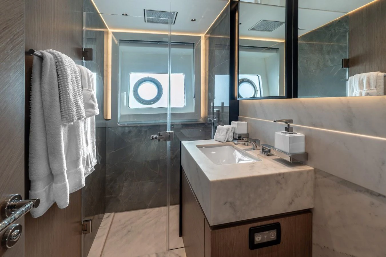 a bathroom with a sink and a mirror aboard AURELIUS Yacht for Sale