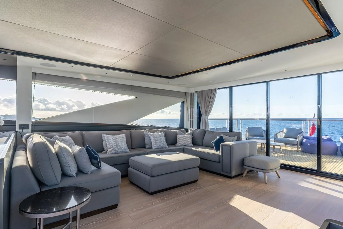 a living room with a large window aboard AURELIUS Yacht for Sale