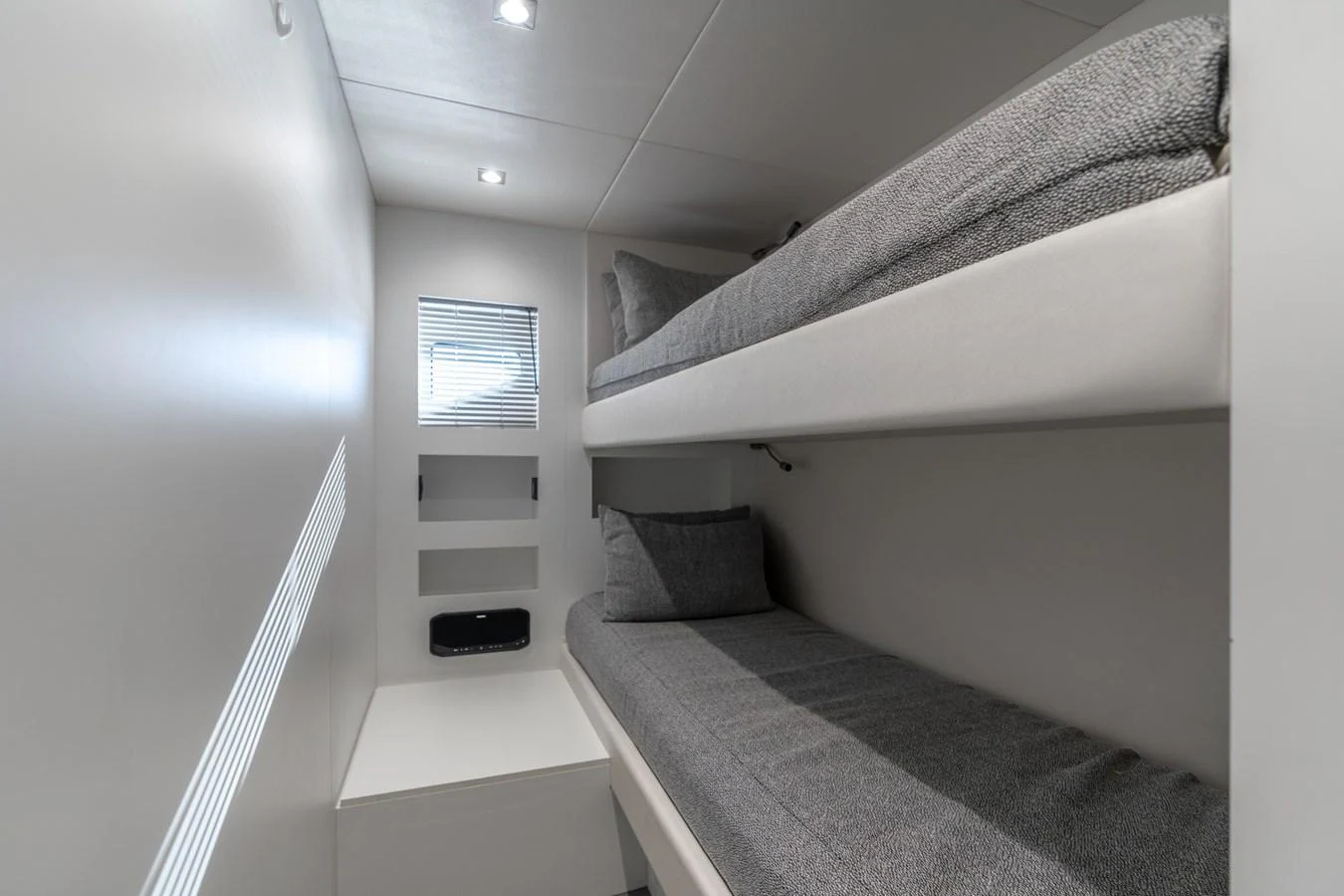 a room with a bed and a window aboard AURELIUS Yacht for Sale