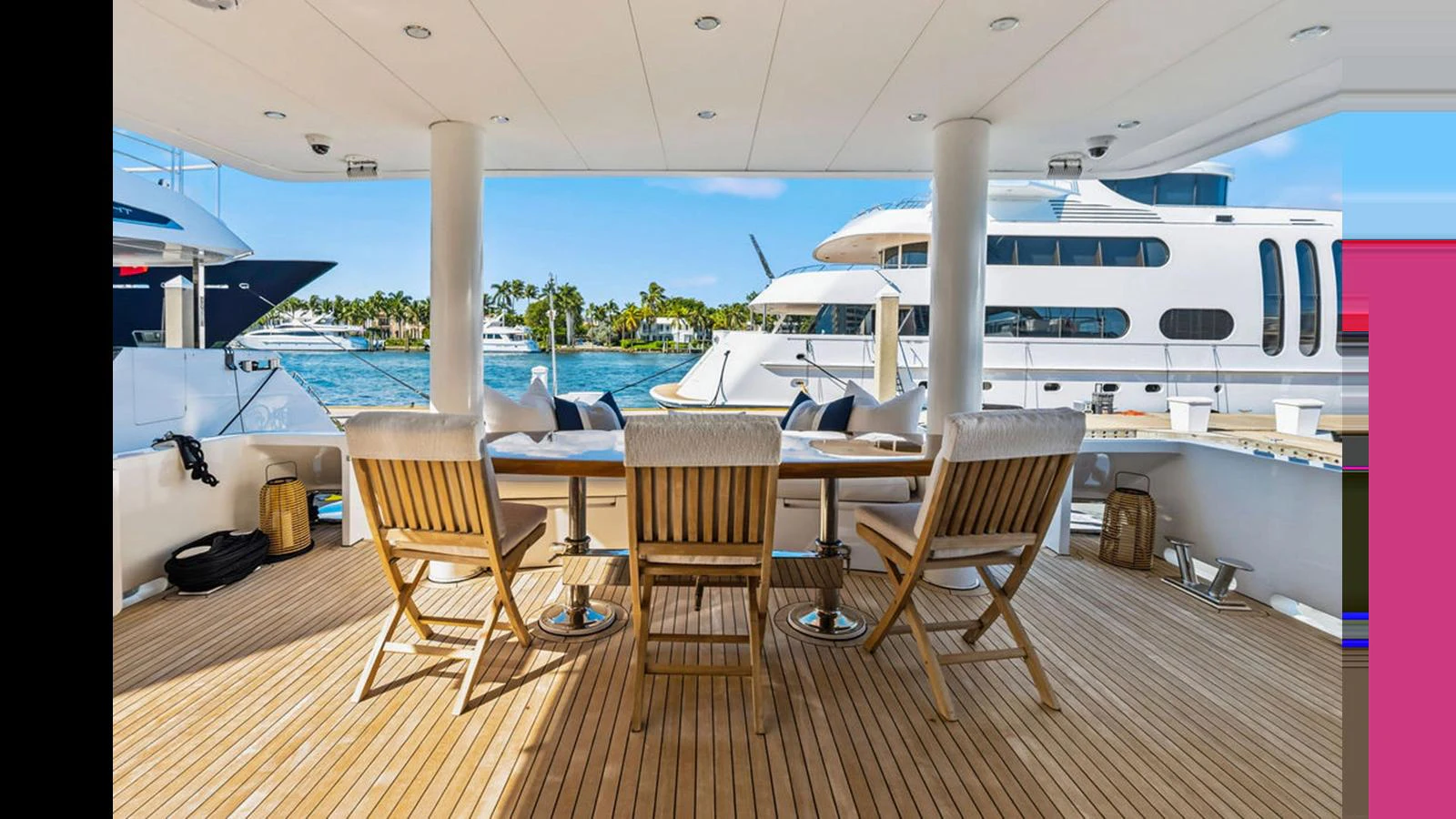The aft deck offers a spacious and inviting area for outdoor dining and relaxation with a stunning view of the marina. aboard PERFECT HARMONY Yacht for Sale