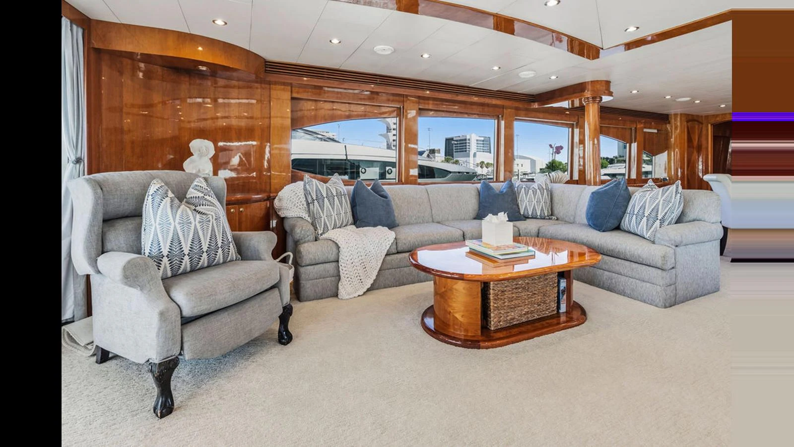 The salon features a spacious seating area with plush sofas and elegant decor. aboard PERFECT HARMONY Yacht for Sale