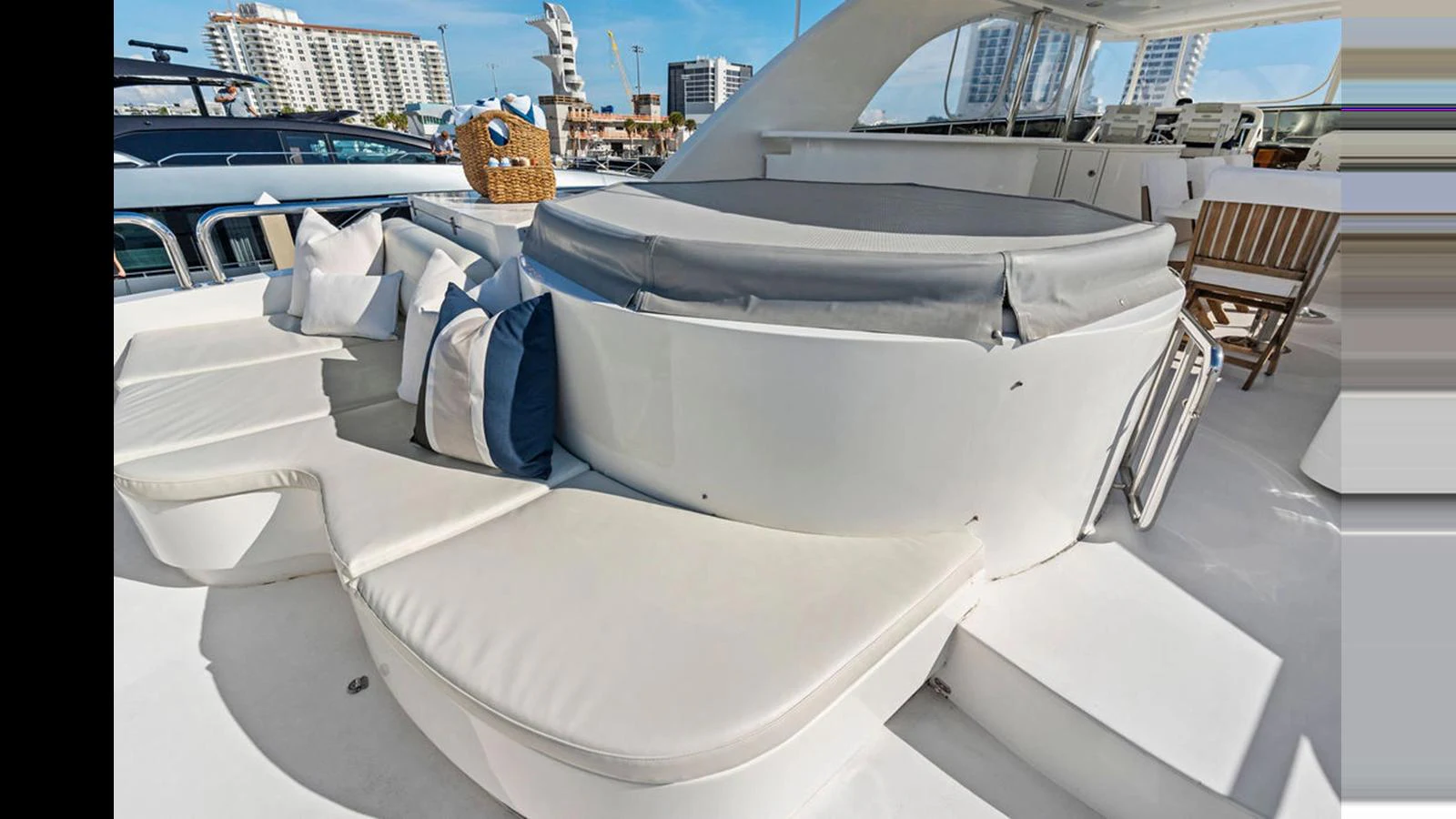 The sundeck features a luxurious hot tub surrounded by comfortable seating and plush cushions. aboard PERFECT HARMONY Yacht for Sale