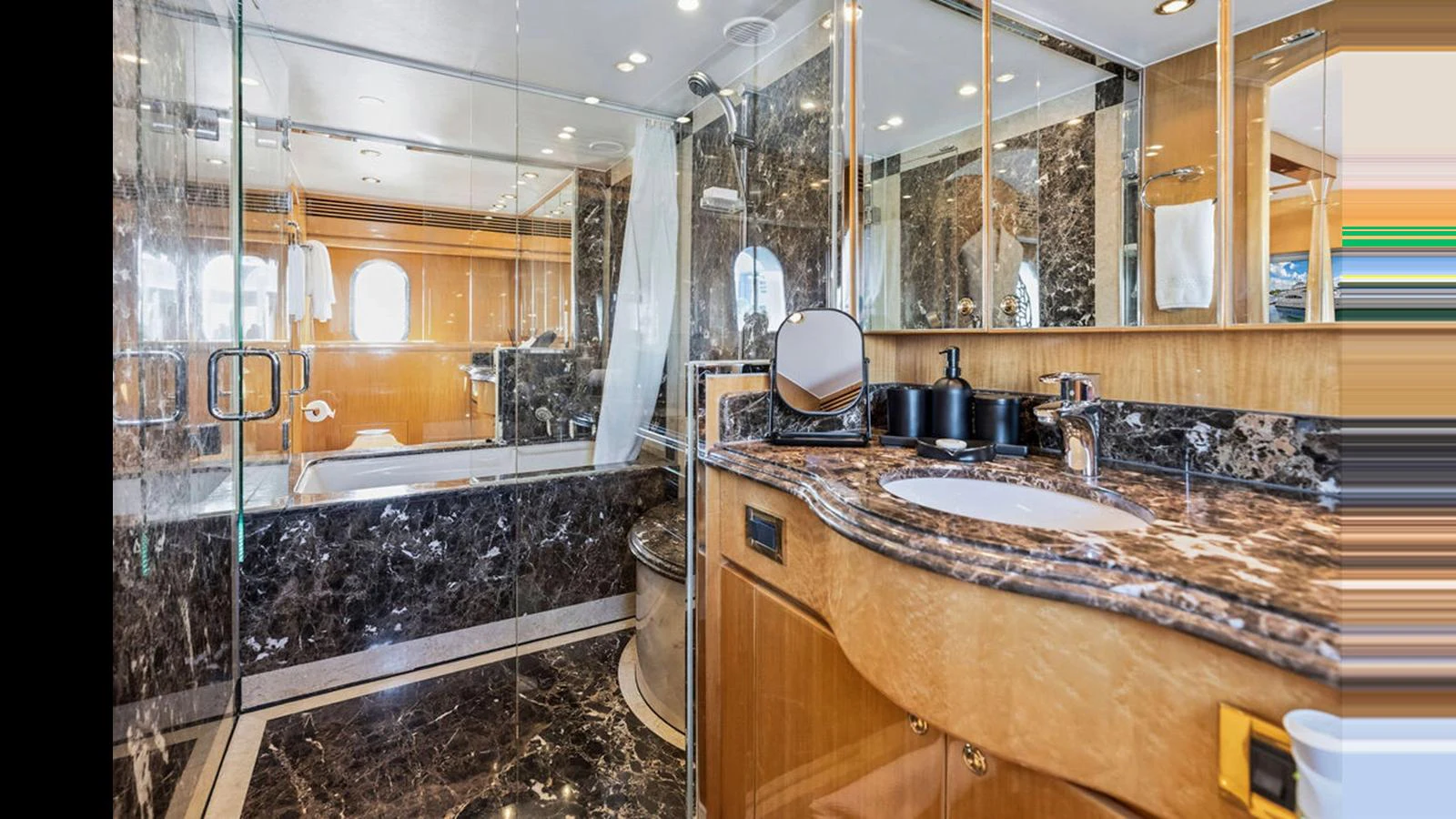 The yacht's bathroom features luxurious marble surfaces and modern fixtures. aboard PERFECT HARMONY Yacht for Sale