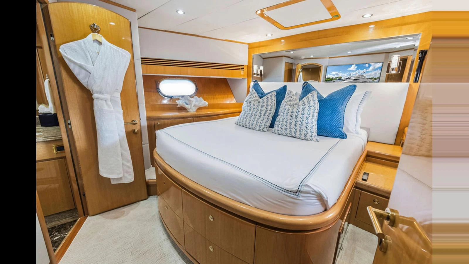 This cozy stateroom features a plush bed with elegant bedding and ample storage space. aboard PERFECT HARMONY Yacht for Sale
