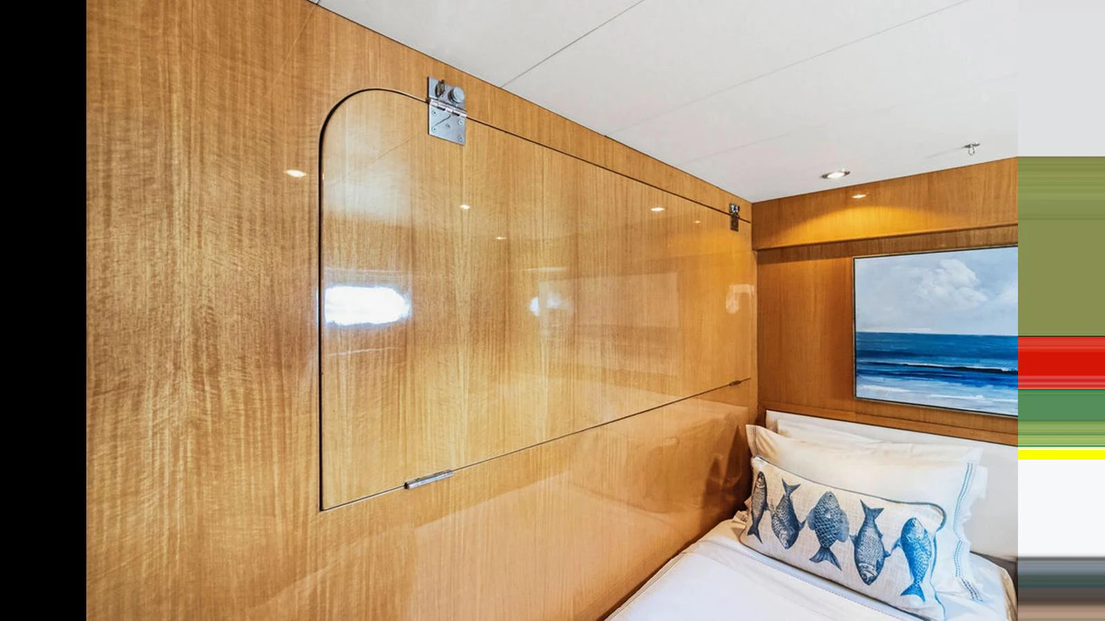 A cozy stateroom featuring wooden paneling and nautical-themed decor. aboard PERFECT HARMONY Yacht for Sale