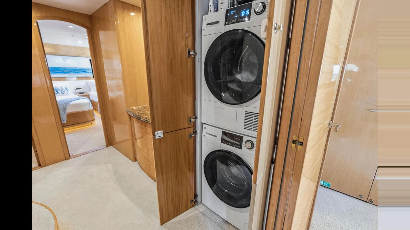 The yacht features a compact and efficient laundry area with modern appliances. aboard PERFECT HARMONY Yacht for Sale