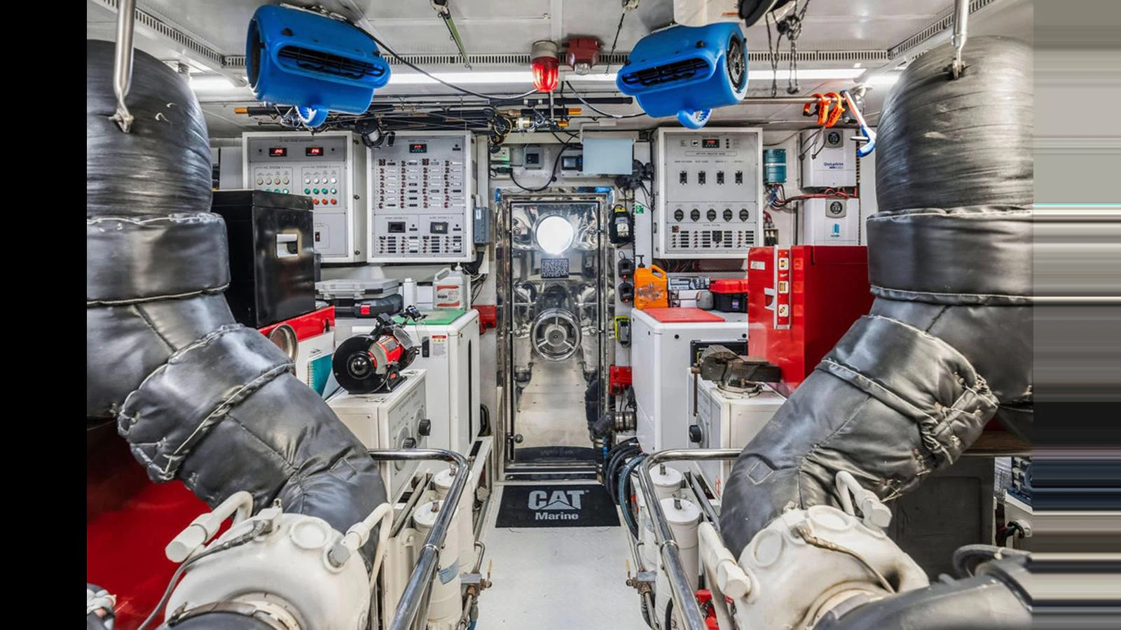 The image showcases the yacht's well-equipped engine room with advanced machinery and control panels. aboard PERFECT HARMONY Yacht for Sale
