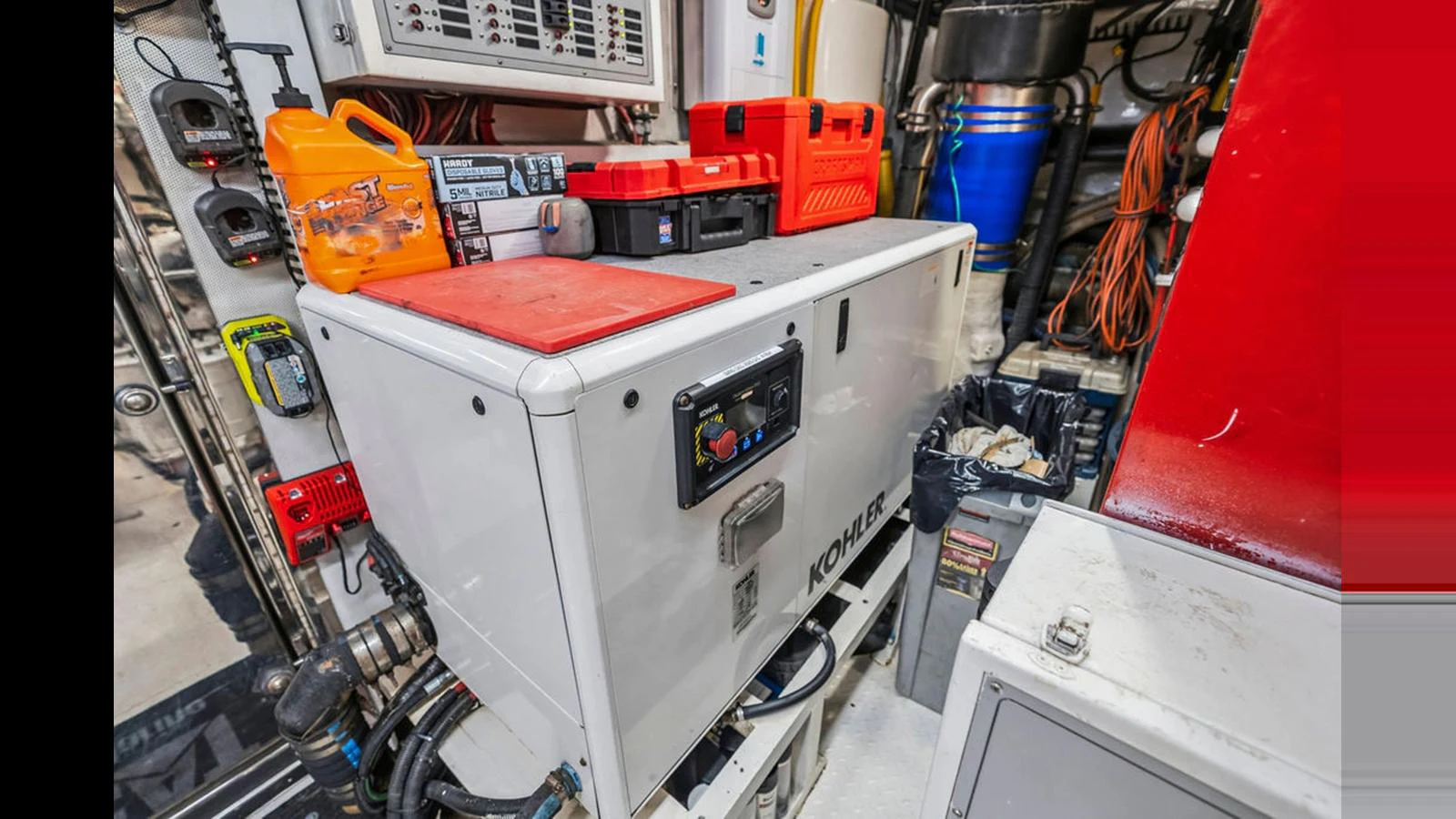 The engine room is equipped with various tools and machinery for maintenance and operation. aboard PERFECT HARMONY Yacht for Sale