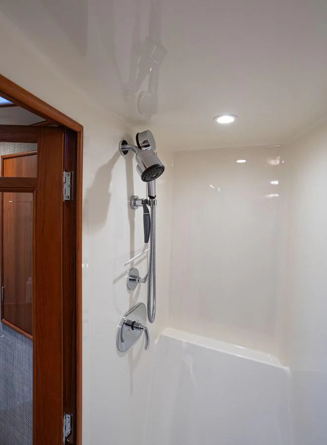 The image showcases a sleek and modern shower area within the yacht's interior. aboard HT HOOK Yacht for Sale