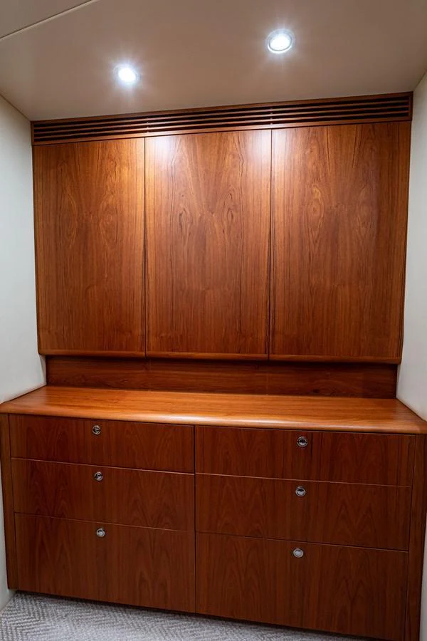 The image showcases a beautifully crafted wooden cabinet within the yacht's interior. aboard HT HOOK Yacht for Sale