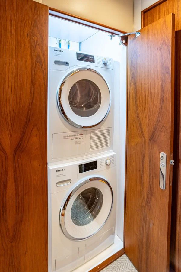 The yacht features a convenient laundry area with modern appliances. aboard HT HOOK Yacht for Sale