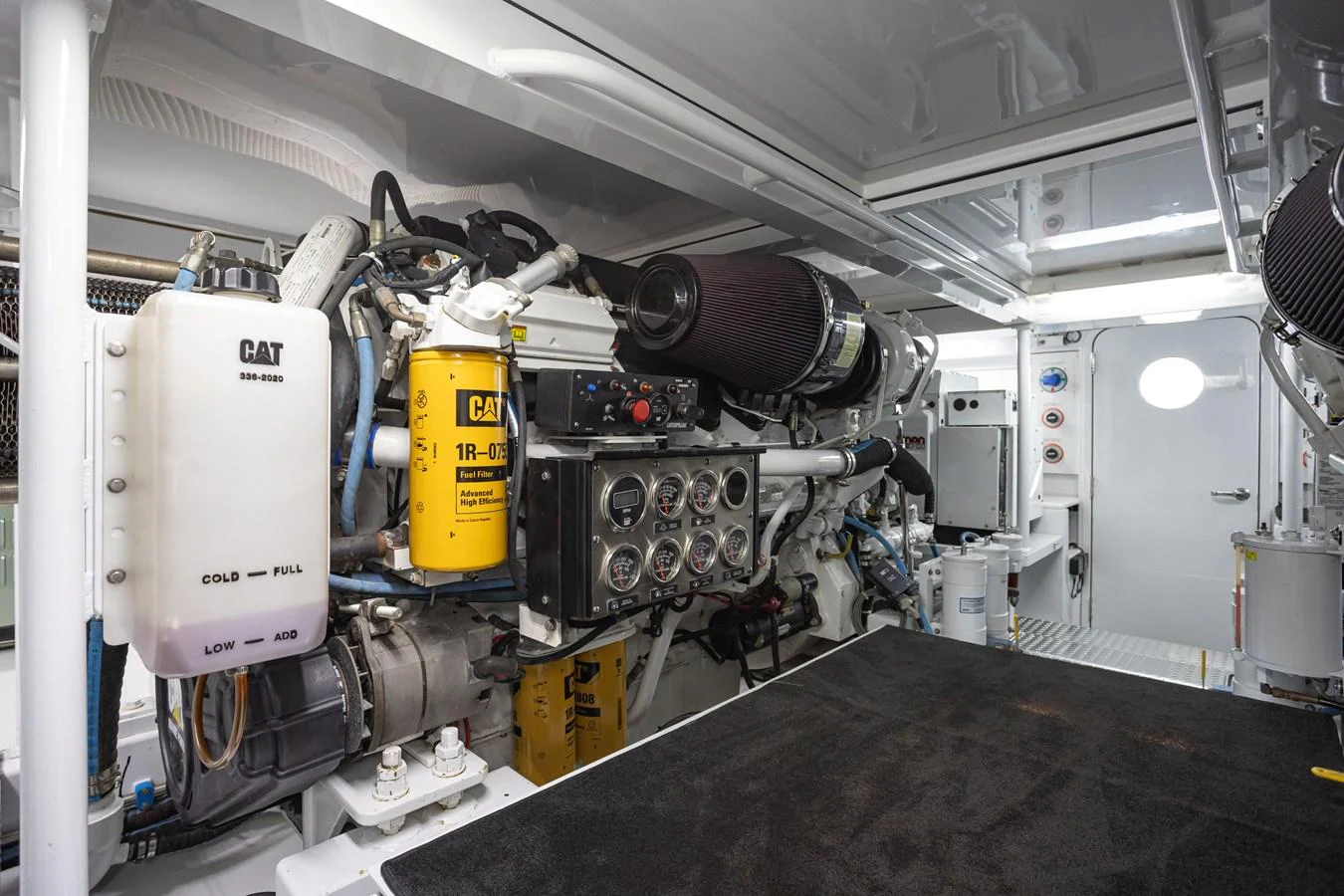 The engine room is meticulously organized, showcasing advanced machinery and systems. aboard HT HOOK Yacht for Sale