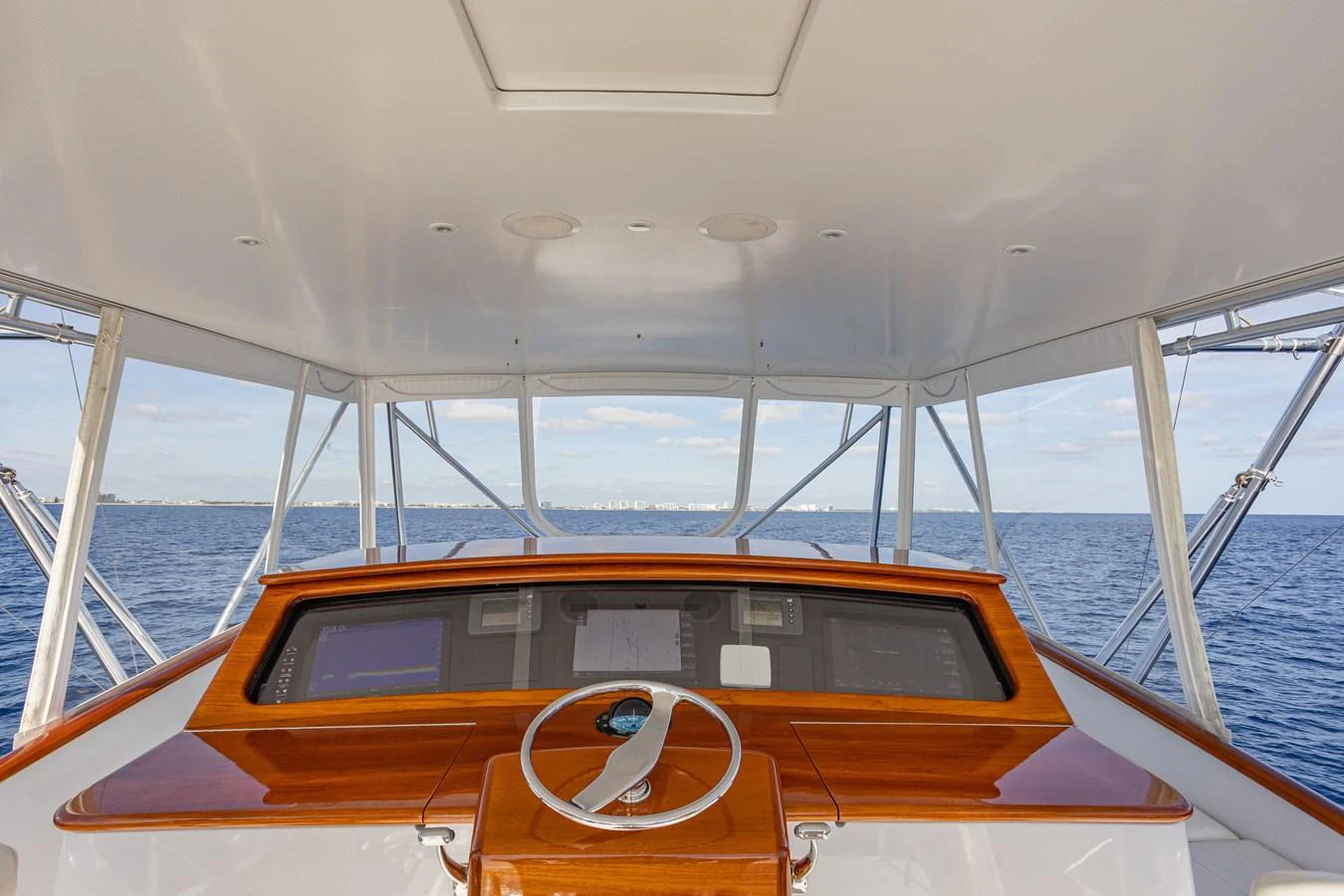 The helm station offers a commanding view of the open sea with state-of-the-art navigation equipment. aboard HT HOOK Yacht for Sale