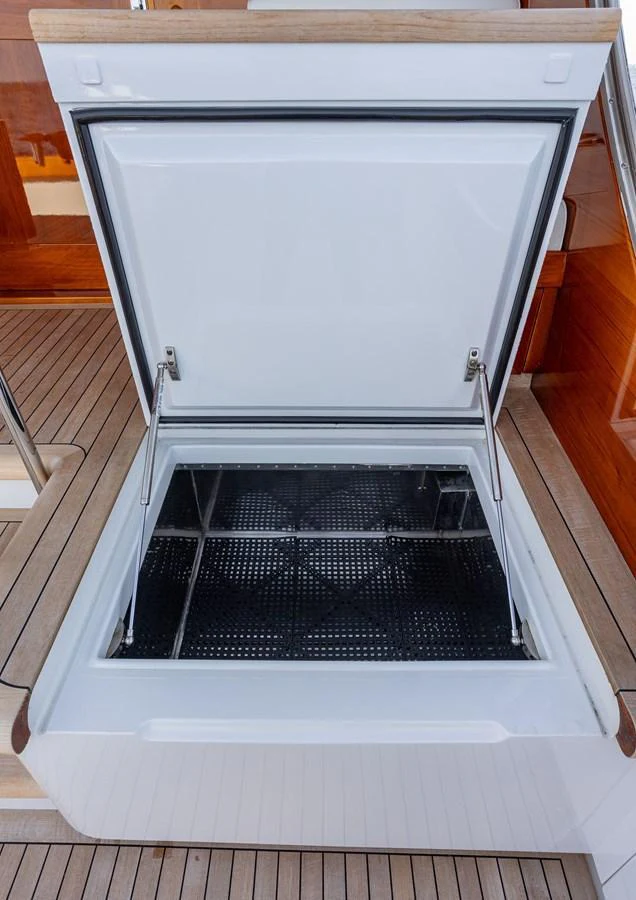 A close-up view of an open storage compartment on the yacht's deck. aboard HT HOOK Yacht for Sale