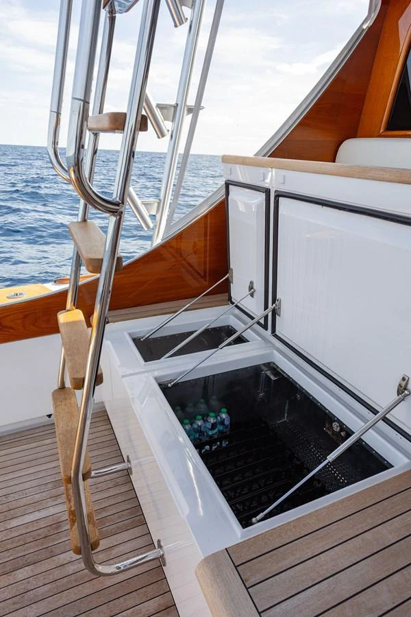 This image showcases a built-in cooler on the deck of a yacht, perfect for keeping beverages chilled while at sea. aboard HT HOOK Yacht for Sale