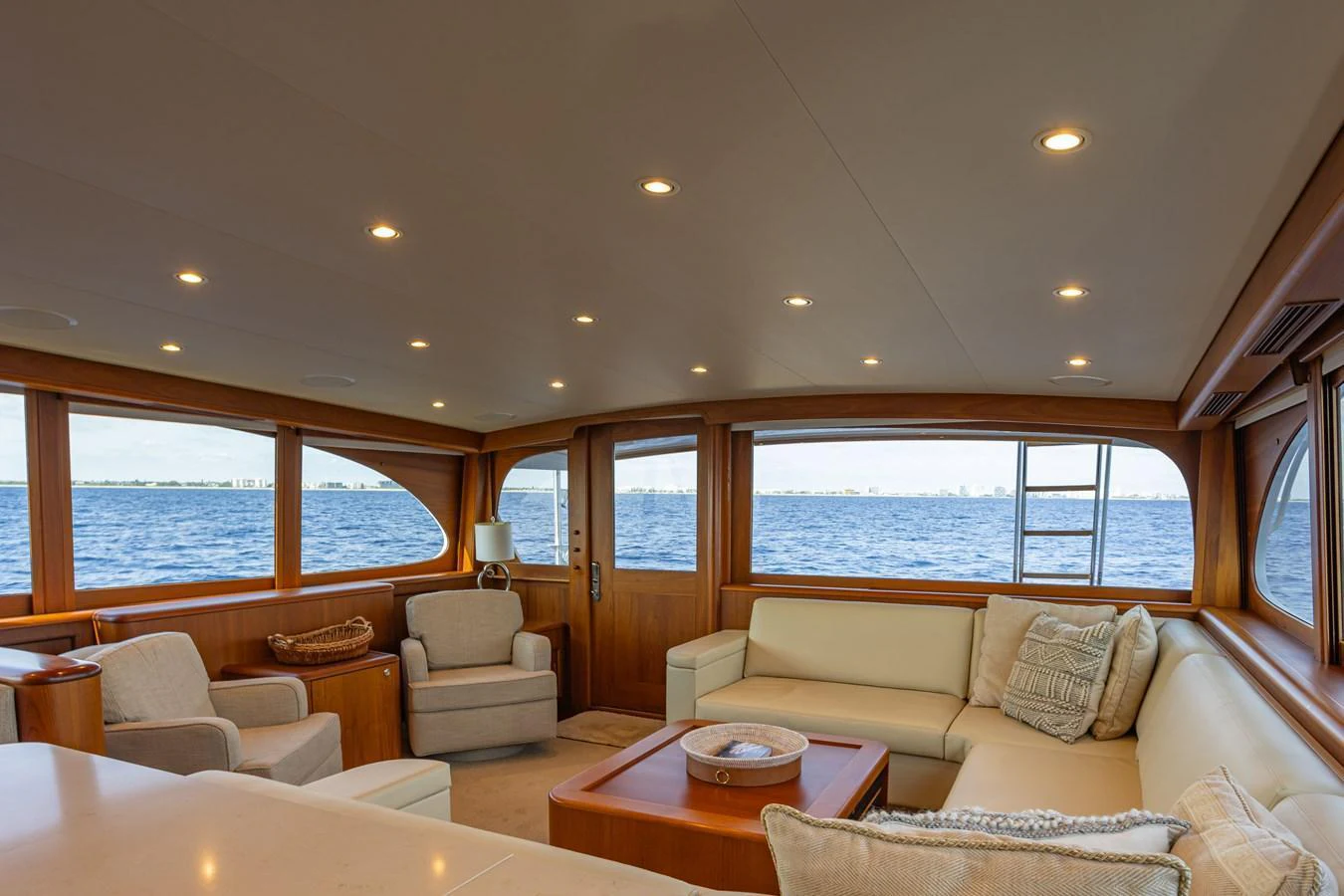 The yacht's salon offers a spacious and comfortable seating area with panoramic views of the sea. aboard HT HOOK Yacht for Sale