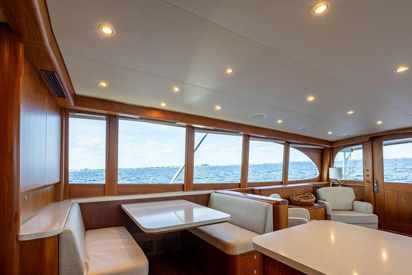 The saloon offers a spacious and inviting area with ample seating and large windows providing stunning ocean views. aboard HT HOOK Yacht for Sale
