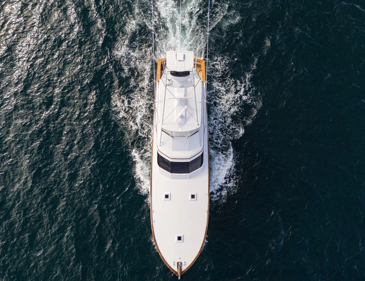 Aerial view of a sleek yacht cruising through the water. aboard HT HOOK Yacht for Sale