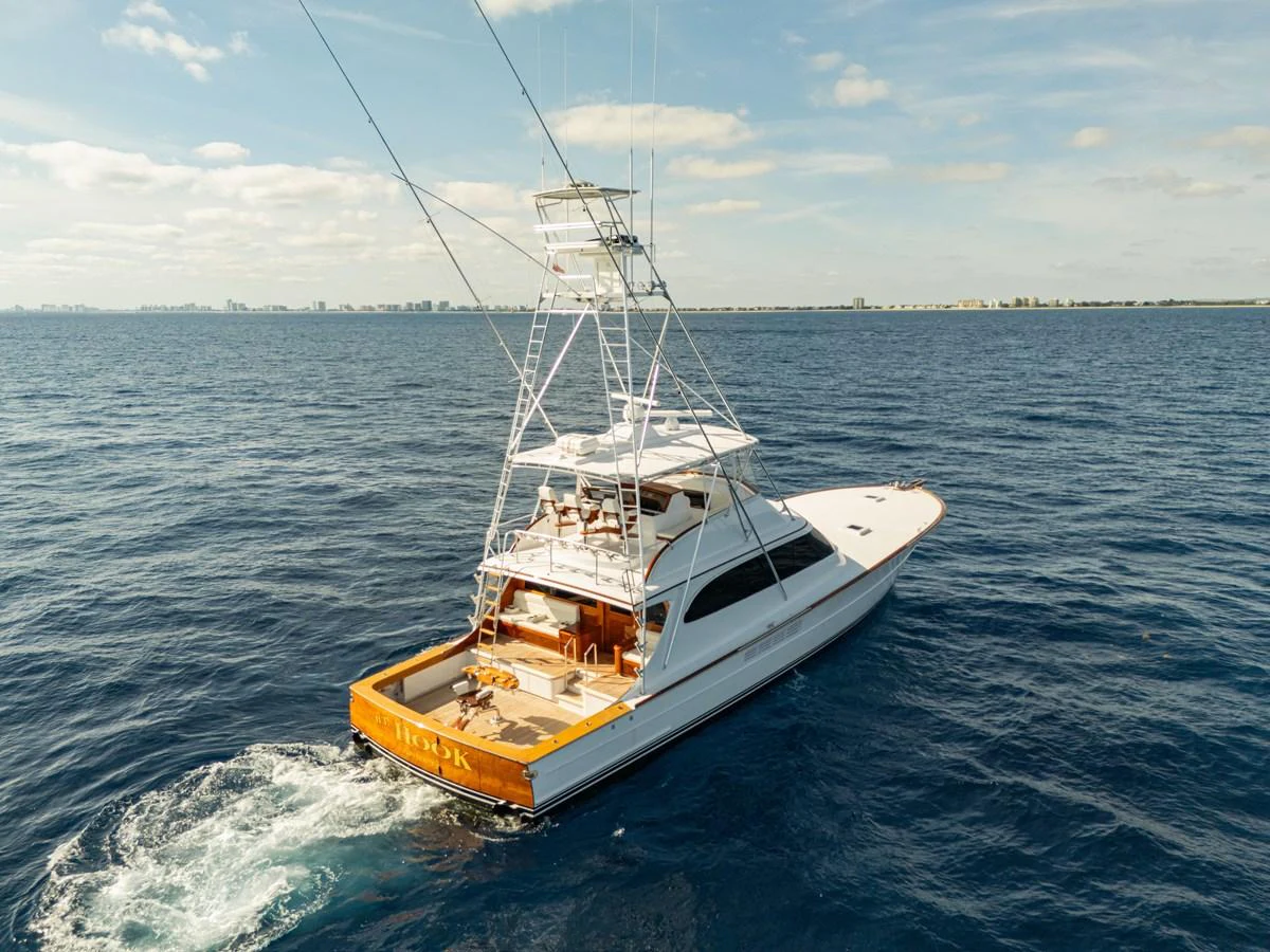 A sleek yacht cruises through the open water, showcasing its elegant design and spacious deck. aboard HT HOOK Yacht for Sale
