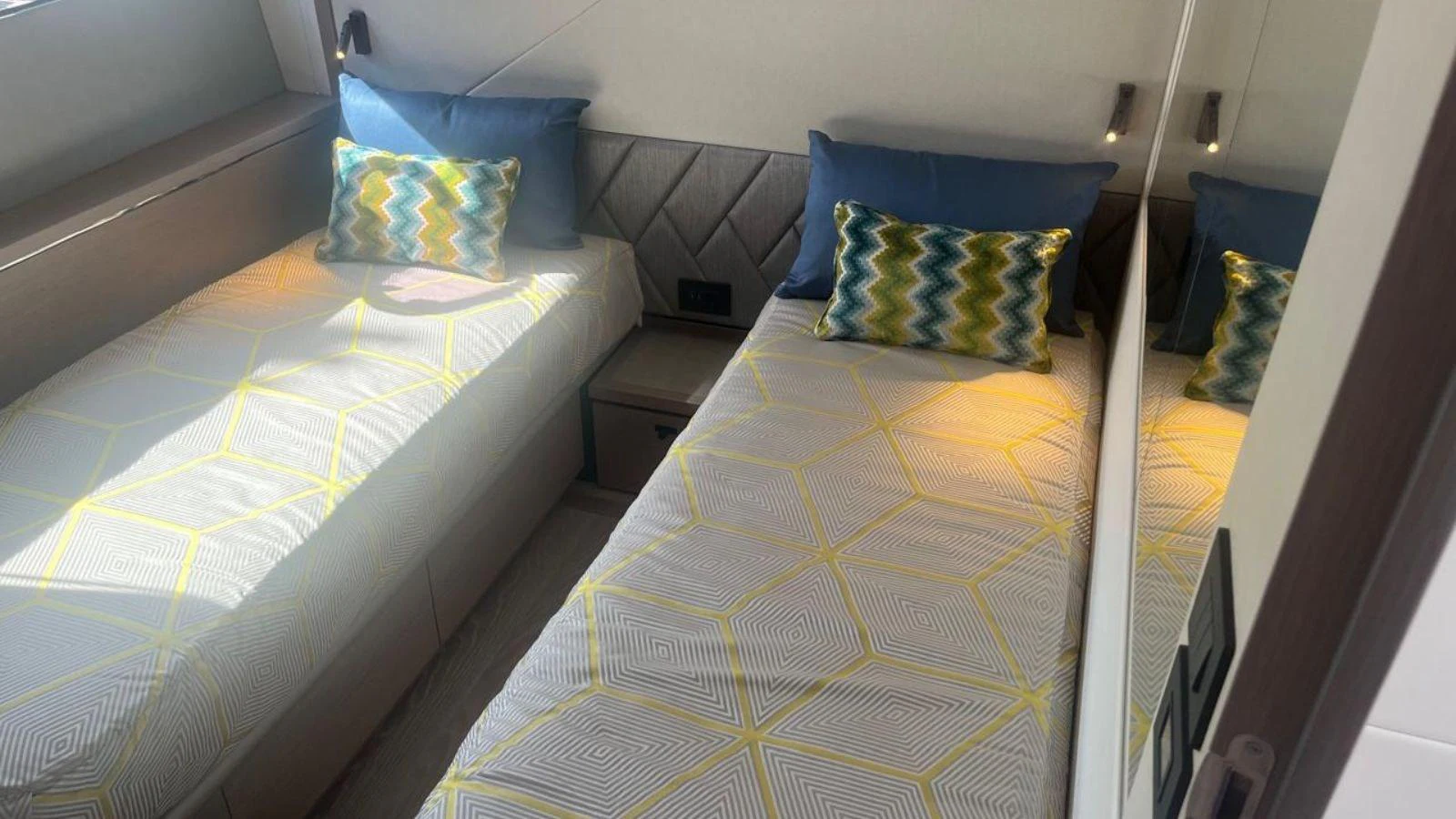 a couple of beds in a room aboard GIOIA Yacht for Sale
