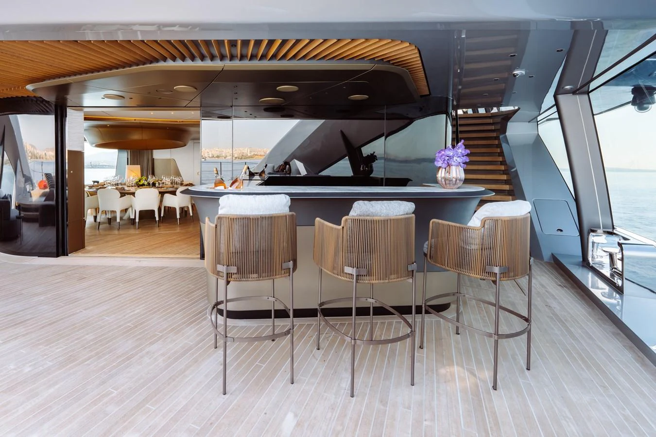 a large kitchen with a bar and chairs aboard THIS IS IT I Yacht for Sale