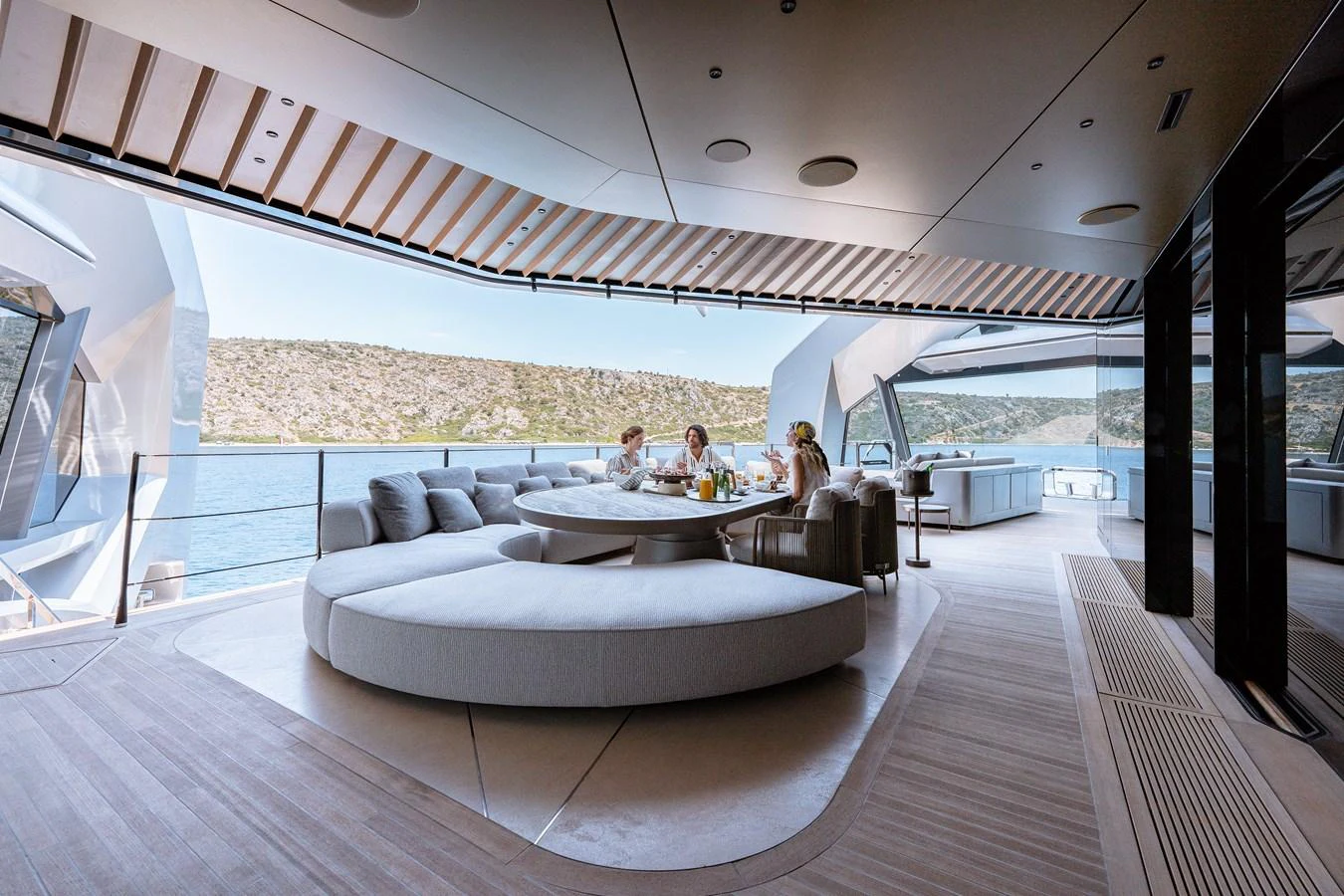 a large living room with a large open roof aboard THIS IS IT I Yacht for Sale