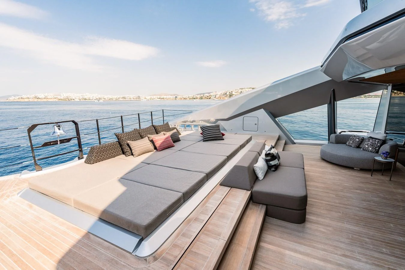 a deck with a view of the water and a city aboard THIS IS IT I Yacht for Sale