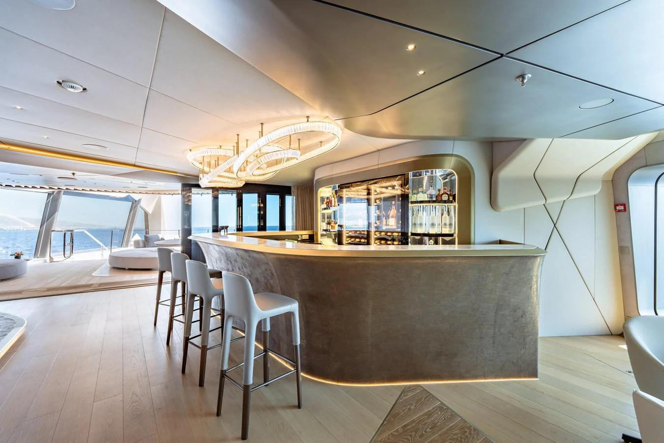 a large room with a bar and chairs aboard THIS IS IT I Yacht for Sale