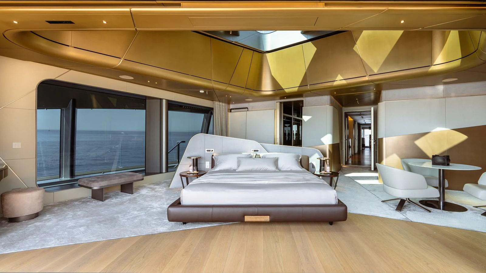 a large room with a bed and a table aboard THIS IS IT I Yacht for Sale