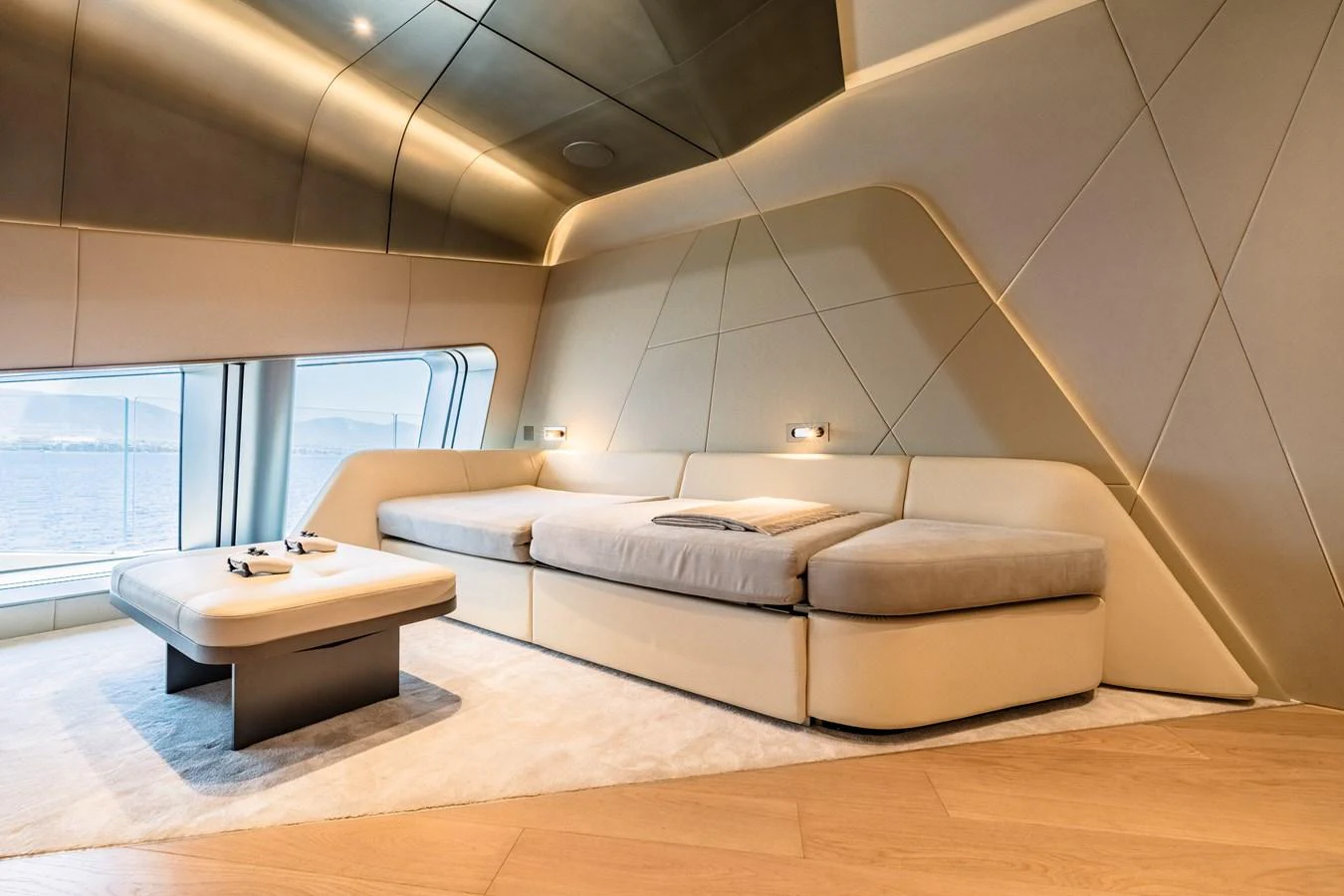 a room with a couch and a table aboard THIS IS IT I Yacht for Sale